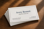 Six personalized 14 pt gloss business cards showing realistic white cut edges and modest stock thickness