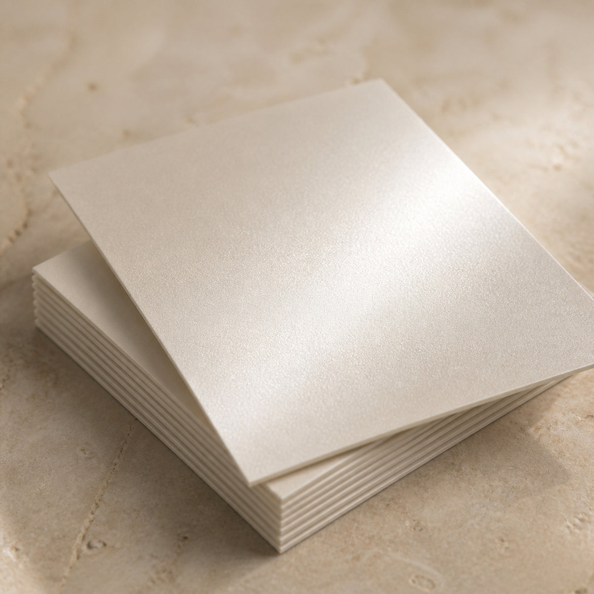 A stack of 5x7 cards on 18pt Ultra Premium Pearl, showing the shimmer across the sheet and the stacked edge